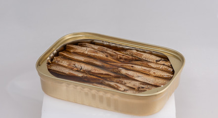 open tin can with sardines