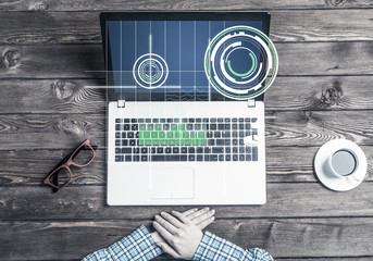 Business workplace with laptop device coffee cup and media graphs and diagrams