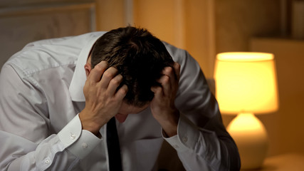 Anxious politician feeling stressed after unsuccessful speech, desperation