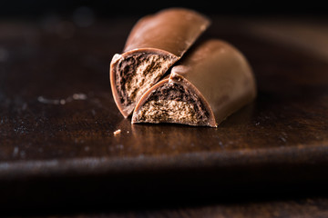 Tiramisu Flavored Chocolate Bar on Dark Wooden Surface.