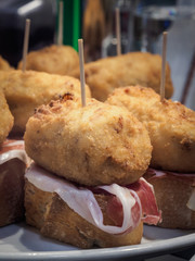 Iberian ham croquette in a pinchos bar in Bilbao, typical tapa in Spain