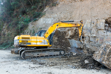 Road widening using earth excavating machinery