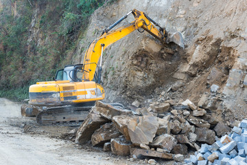 Road widening using earth excavating machinery