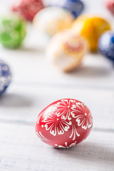 Close-up multicolored easter eggs on wooden table