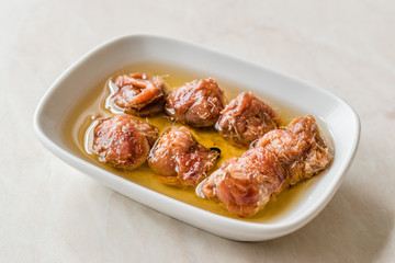 Marinated Canned Anchovy Fillet in Bowl / Anchovies served with Black Pepper on Marble Board.