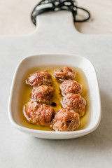 Marinated Canned Anchovy Fillet in Bowl / Anchovies served with Black Pepper on Marble Board.