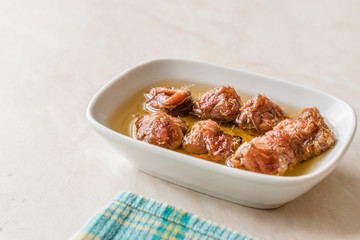 Marinated Canned Anchovy Fillet in Bowl / Anchovies served with Black Pepper on Marble Board.