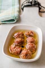 Marinated Canned Anchovy Fillet in Bowl / Anchovies served with Black Pepper on Marble Board.