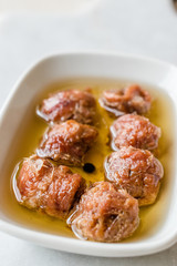 Marinated Canned Anchovy Fillet in Bowl / Anchovies served with Black Pepper on Marble Board.