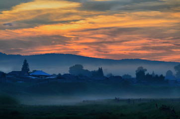 Summer evening. Fog appears in the lowlands. It becomes cool and damp. Smells like herbs and berries