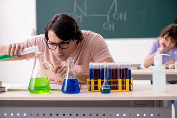 Two chemists students in classroom 