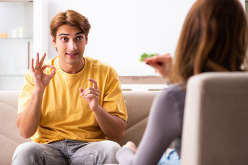 Woman and man learning sign language