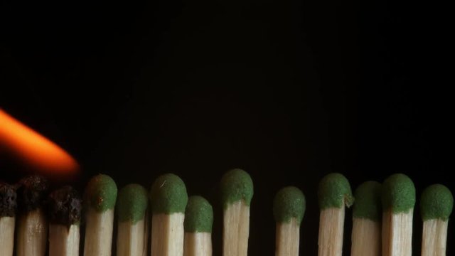 Ignition of matches in the line. Sequence of flaming matches.