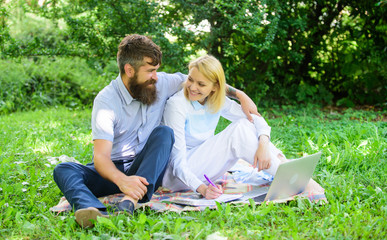 Couple youth spend leisure outdoors working with laptop. Couple in love or family work freelance. Modern online business. Freelance life benefit concept. How to balance freelance and family life