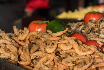 Spanish traditional fried shrimps and vegetables. Close view. Selective focus