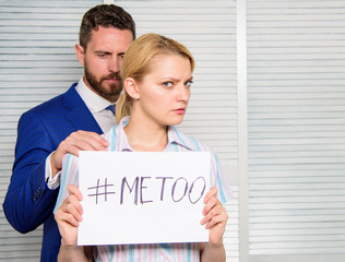 Sexual assault and harassment at workplace. Woman showing a note with the text me too. Sexual...