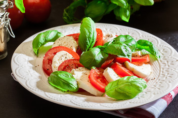 Caprese salad with mozzarella, tomato, basil