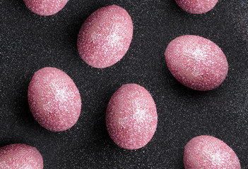 Layout of a lot of shiny decorated eggs for Easter celebration.Top view