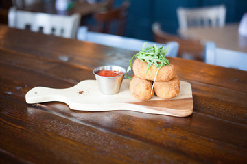 3 baked croutons with tomato sauce