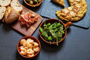 Authentic Spanish tapas with padron peppers and traditional tortilla