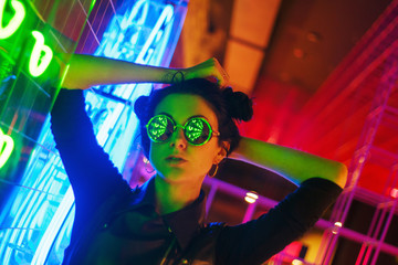 Cinematic night portrait of girl and neon lights