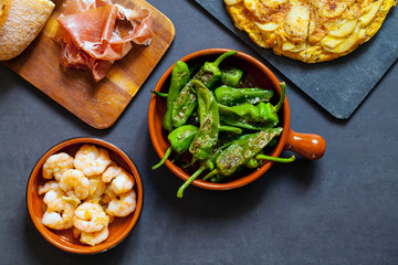 Authentic Spanish tapas with padron peppers and traditional tortilla