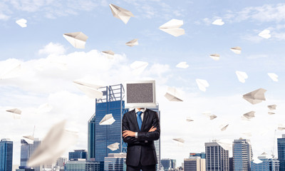 Businessman with monitor instead of head.