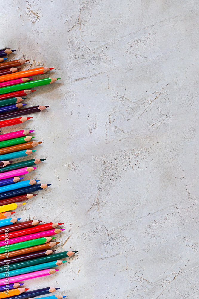 Poster Pecils of different colors on cement grey background in vertical composition, Kid, Children, Education, Art, Drawing, Graphic, Diagonal, Copy space, Empty