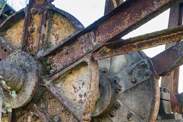 Old rusty waterwheel. No longer in use