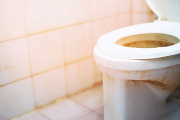 unclean dirty old toilet bowl in the bathroom. Is a collection of germs disease bacteria. Should...