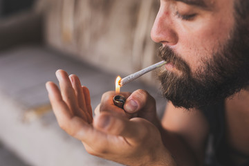 Man lighting a joint