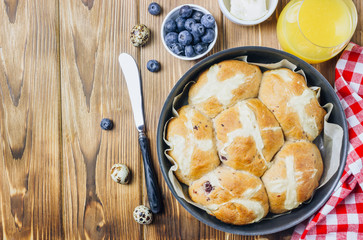 Traditional Easter treats cross buns wwith fresh butter