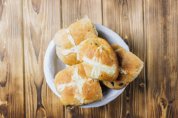 Traditional Easter treats cross buns wwith fresh butter