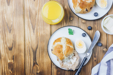 Traditional Easter treats cross buns wwith fresh butter