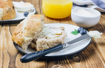 Traditional Easter treats cross buns wwith fresh butter