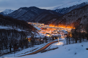 Ski resort town Krasnaya Polyana, Gorki street the City is surrounded by snowy peaks at 540 and 960 meters