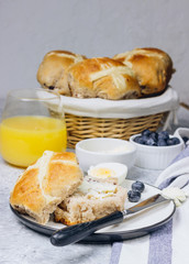 Traditional Easter treats cross buns wwith fresh butter