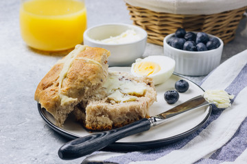Traditional Easter treats cross buns wwith fresh butter