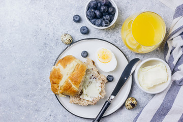 Traditional Easter treats cross buns wwith fresh butter