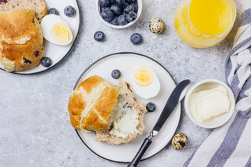 Traditional Easter treats cross buns wwith fresh butter
