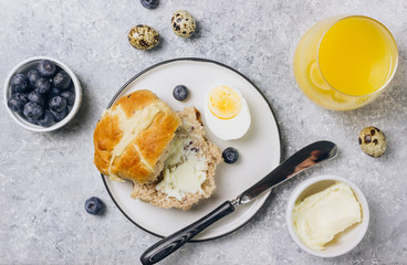 Traditional Easter treats cross buns wwith fresh butter