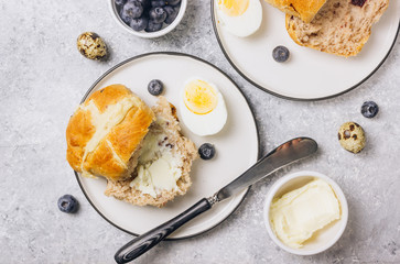Traditional Easter treats cross buns wwith fresh butter