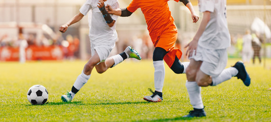 Soccer Shot. Young Boys Kicking Football Soccer Tournament Match on the Grass Pitch. Football...