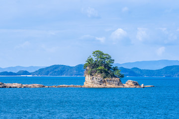 Many small islands over the blue ocean in sunny day, famous Kujukushima(99 islands) pearl sea...