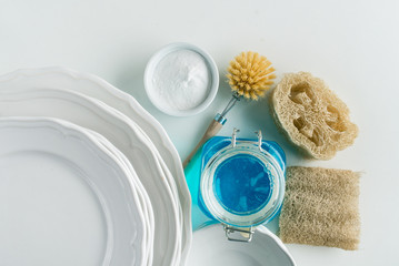 dish washing with zero waste brushes. sponges, soda and soap. flat lay minimalistic