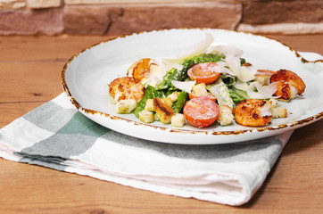 Shrimp Caesar salad with Parmesan cheese, croutons and lettuce