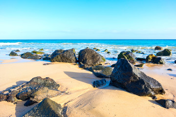 Stones on sandy beach