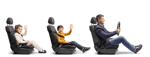 Father with son and daughter waving in car seats