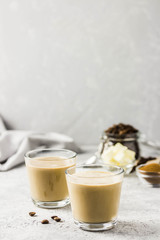 Keto bulletproof coffee in glasses. Selective focus, space for text.