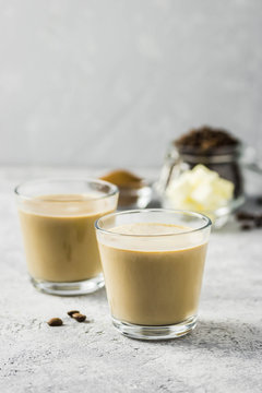 Keto bulletproof coffee in glasses. Selective focus, space for text.